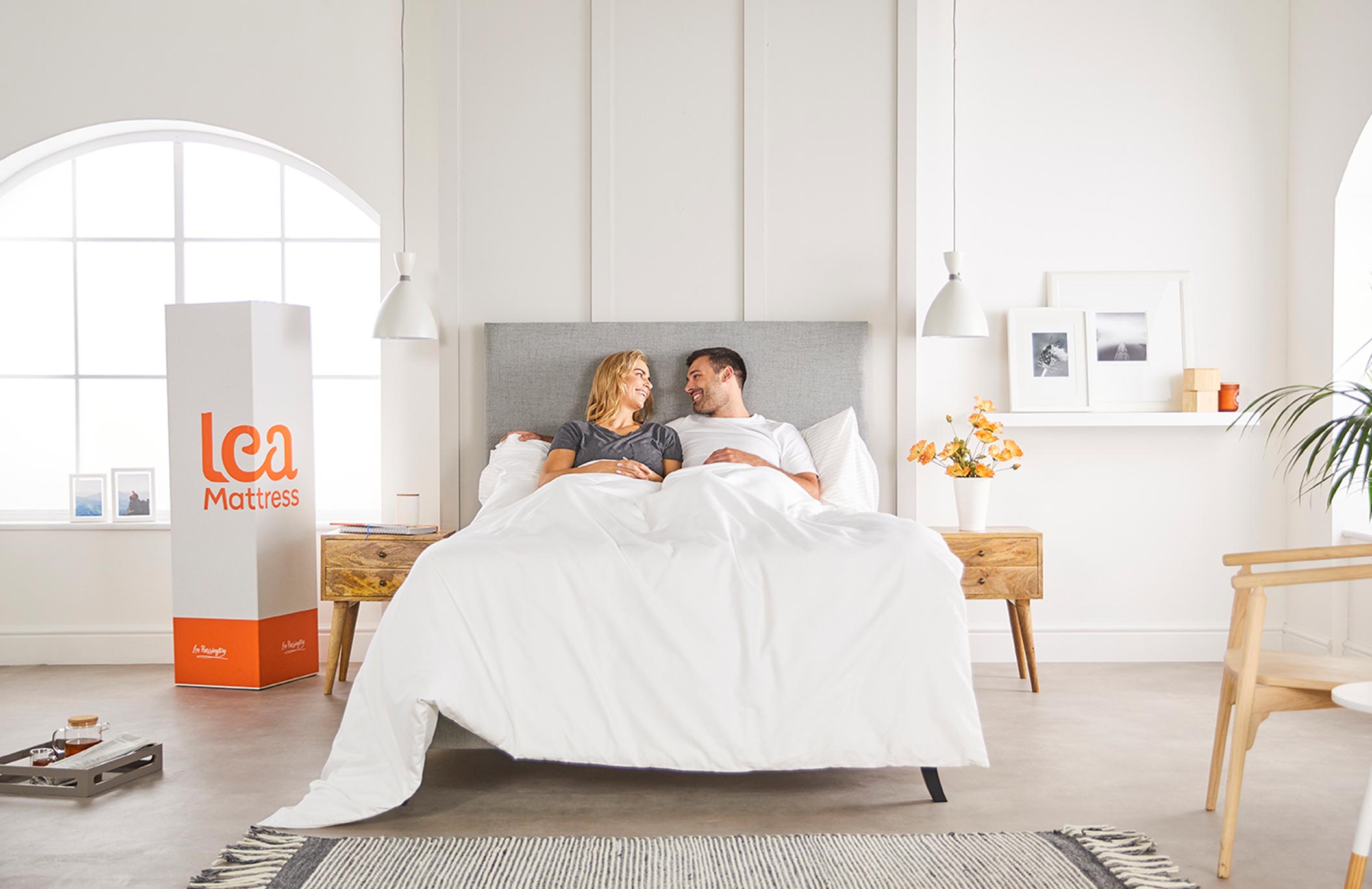 couple in bed on new mattress